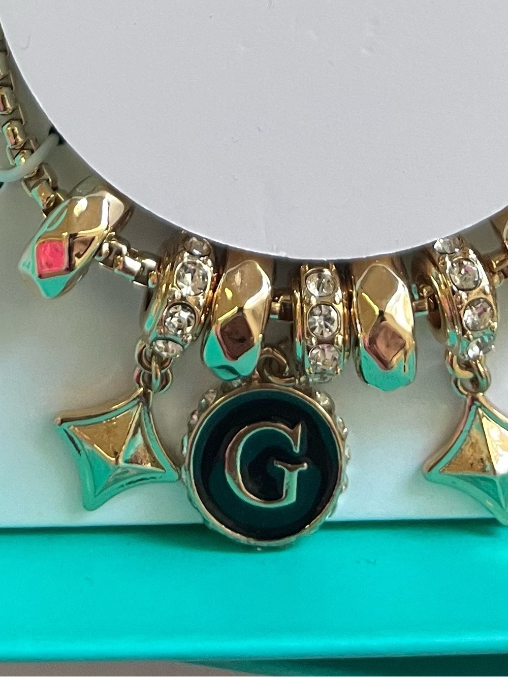 GUESS Gold-Tone Charm Bracelet with Black Accent - 7.5in - Picture 2 of 4